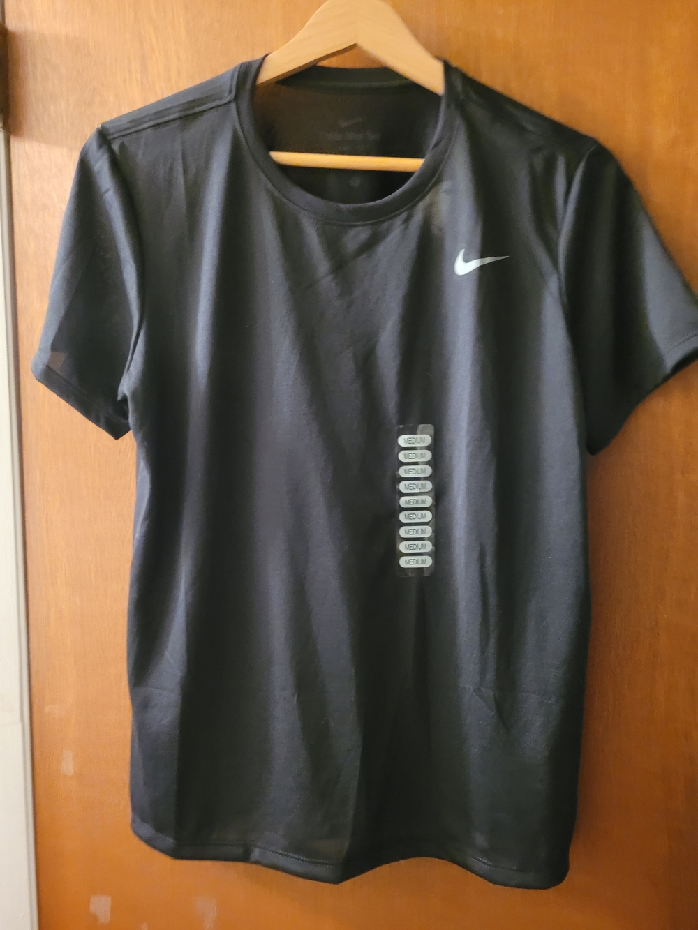 Nike Black Short Sleeve Athletic Tee with White Swoosh